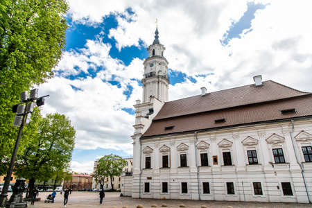 Town Hall White Swan in the center of Kaunas at the Town Hall Square in Lithuania in the spring against a blue sky with cirrus clouds. Kaunas, Lithuania - May, 2019.の写真素材