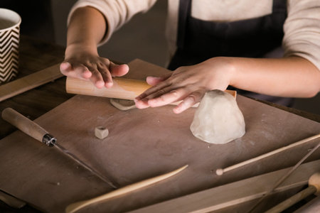 Children's Hands Creating Handmade Ceramics in Clay Close-Up.