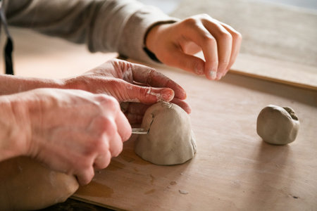 Children's Hands Creating Handmade Ceramics in Clay Close-Up.