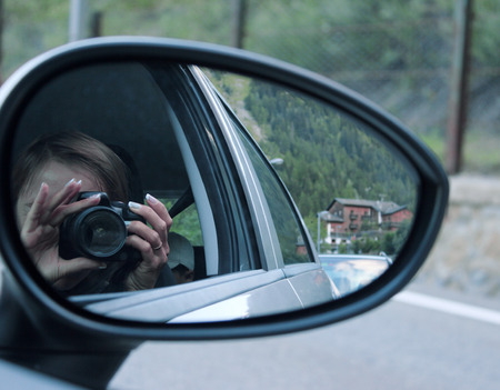 Reflection of the camera through an open windowの写真素材