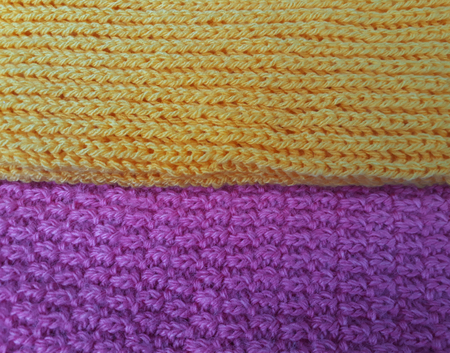 texture of yellow and pink knitting fabricsの写真素材