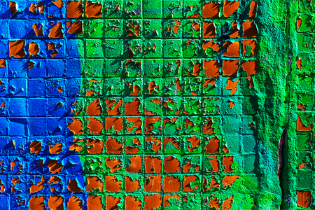 Colored mosaic wall with peeling paint. の写真素材
