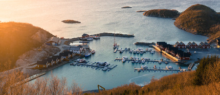 Top view of the harbour with moored yachts and boats  in the village of Tonnes at sunset.の写真素材