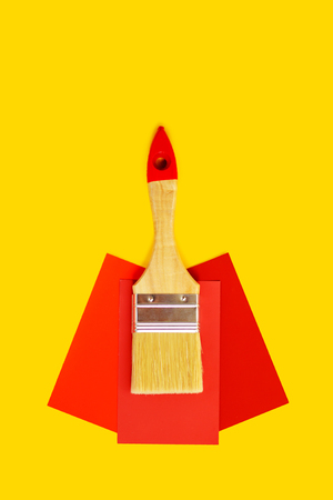 Clean brush and paint color choice template on yellow background with copy space.の写真素材