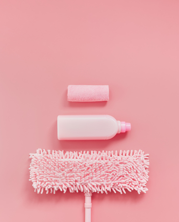 MOP, rag and detergent-pink set on pink background for spring cleaning. Place for text.の写真素材