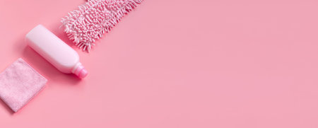 MOP, rag and detergent-pink set for spring cleaning. Top view. Place for text.