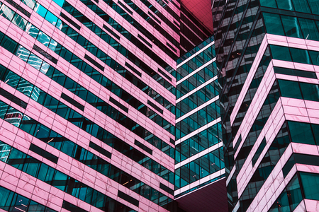 View of modern skyscrapers  - abstract architecture detail in blue and living coral colors.の写真素材