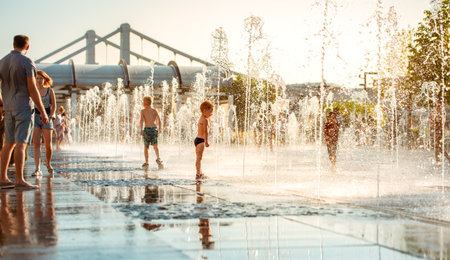 MOSCOW, RUSSIAN FEDERATION - JULY 29, 2018: Muscovites in the intense heat cooled down by jets foot fountain at the Crimean embankment in the Park Muzeon.のeditorial素材
