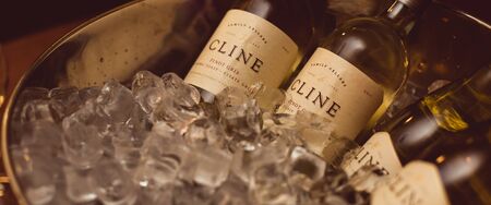 St. Petersburg, Russia-August 16, 2018: bottles of Cline Vionier  and Pino Gris wine in an ice bowl. Preparation for wine training for sommeliers.のeditorial素材