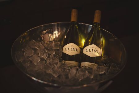 St. Petersburg, Russia-August 16, 2018: bottles of Cline Vionier wine in an ice bowl. Preparation for wine training for sommeliers.のeditorial素材