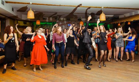 Moscow, Russia-January 19, 2019: people of different races dance in the club and broadcast the partyのeditorial素材