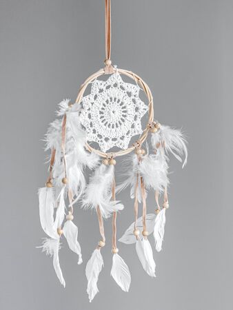 White dreamcatcher at gray background. Interior decoration. Native American Dreamcatcherの写真素材