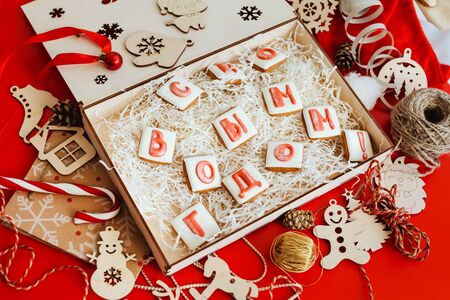 Box with Christmas gingerbread in the form of the russian letters, folding into the words " Happy new year!".の写真素材