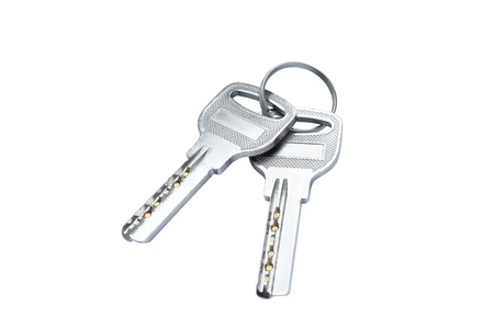 two modern keys isolated over white backgroundの写真素材