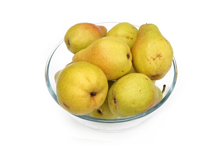 yellow pears on glass dish isolated on a whiteの写真素材