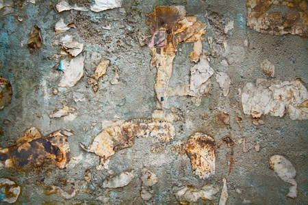rusty grange texture wall with burnt and torn paperの写真素材