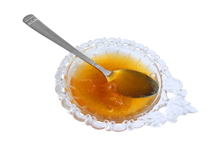 jam bowl with peach jam isolated on a whiteの写真素材