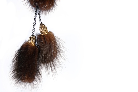 winter hat fur balls isolated on whiteの写真素材