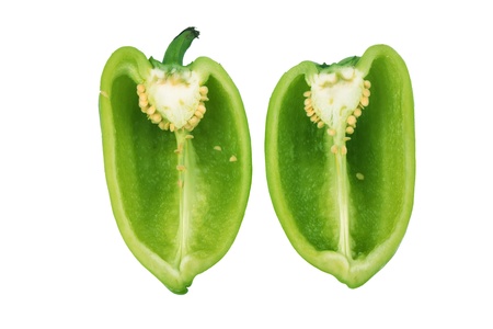 green paprika cut on halfs isolated over white close upの写真素材