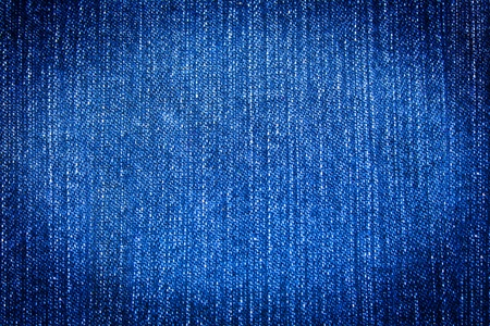blue jeans background with oval vignette の写真素材
