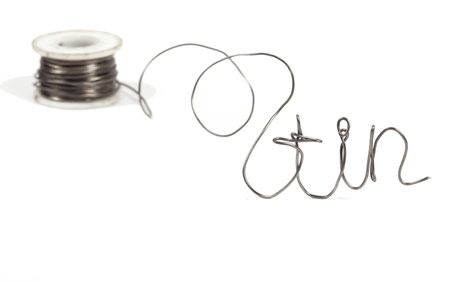 Thick roll of thin welding wire - wire in foreground in focus roll in background out of focus with...