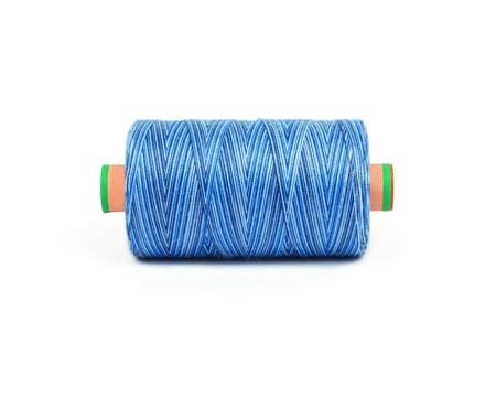 light blue bobbin of professional threads for machine embroidery multicolor melangeの写真素材