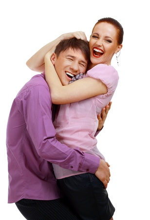 Attractive couple being playful isolated over white background studio shotの写真素材