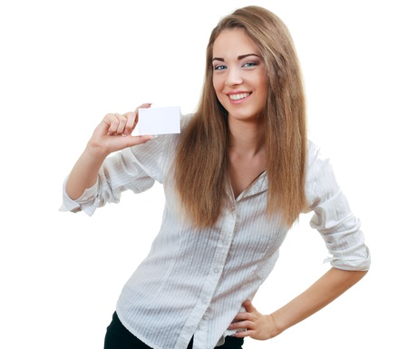 A beautiful happy smiling woman holds out a business or credit card Isolated on white backgroundの写真素材