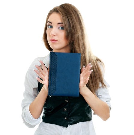 An isolated shot of a beautiful student girl showing a book with blank cover making presentationの写真素材