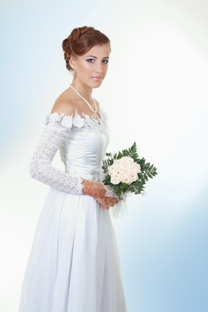 portrait of a beautiful bride wiht a bouquet of flowersの写真素材