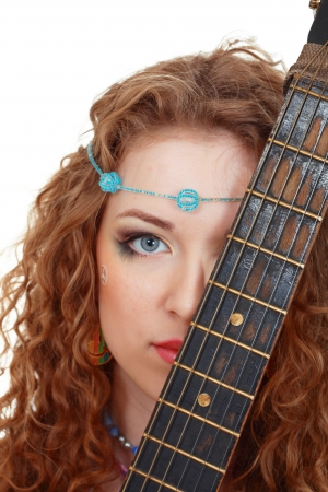Beautiful Girl holding guitar on white background close upの写真素材