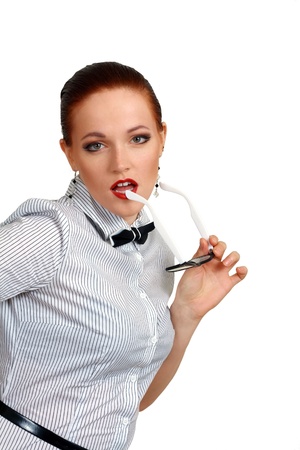 portrait of young business woman or teacher holding eye-glasses in hands and white smileの写真素材