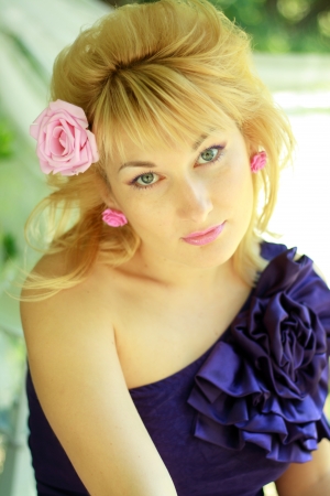 Romantic young woman outdoors at a summer day. Soft summer colors.の写真素材