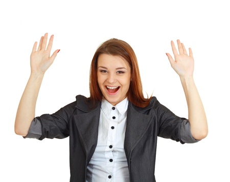 beautiful woman giving up and raises her hands with charming smileの写真素材