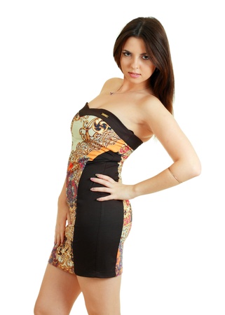 Portrait of trendy young woman in funky dress smiling against white backgroundの写真素材