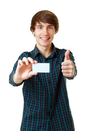 Young smiling man holding blank white card to write it on your own text isolated on white backgroundの写真素材
