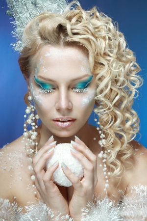 ce-queen. Young woman in creative image with silver blue artistic make-up and perfect hairstyle.の写真素材