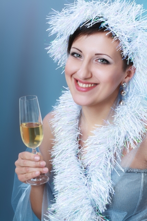 beautiful young woman with creative white hat drinking Champagneの写真素材