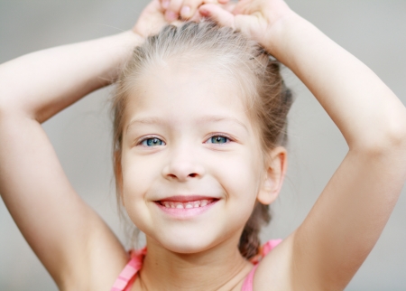 Adorable little girl taken closeup outdoors in summerの写真素材