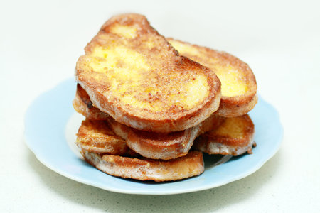 fresh french toasts on plate close up