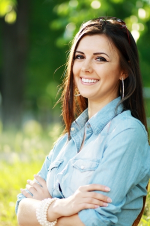 surprised overjoyed happy woman outdoor over green backgroundの写真素材