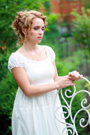 Portrait of beautiful thoughtful romantic woman in a summer garden の写真素材