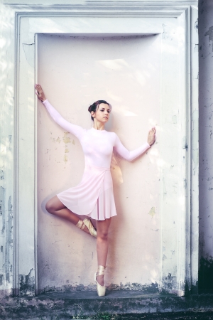 Young beautiful ballerina dancing outdoors in a park. Ballerina Project.の写真素材
