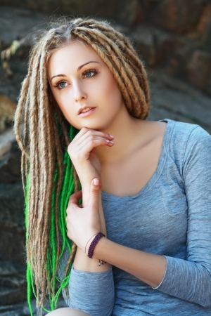 Dreadlocks. Fashion hairstyle with dreads - beauty woman faceの写真素材