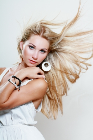 Woman face with hair motion studio shotの写真素材