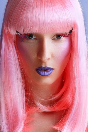 Gorgeous model beautiful women with perfect art make up and long false eyelashes made from feathers and pink hairの写真素材