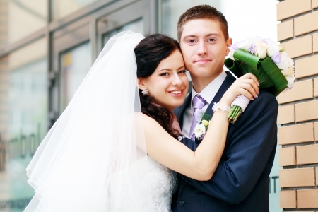 Bride and groom hugging outdoor real peopleの写真素材
