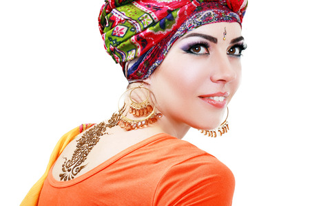 Beautiful woman portrait with painted Mehandi fresh pattern applied henna on her back の写真素材