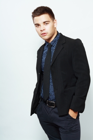 handsome young teen man in suit studio shotの写真素材