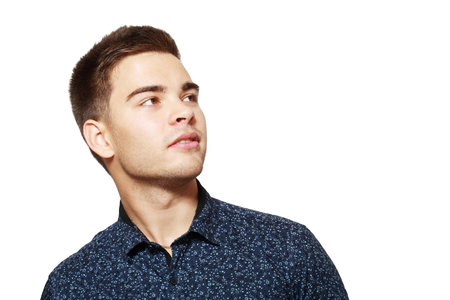 Handsome smiling young man businessman or student looking to copyspaceの写真素材